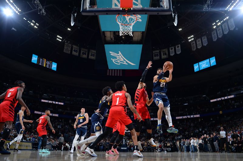 DENVER, CO - JANUARY 17: Jamal Murray #27 of the Denver Nuggets drives to the basket during the game against the Portland Trail Blazers on January 17, 2023 at the Ball Arena in Denver, Colorado. NOTE TO USER: User expressly acknowledges and agrees that, by downloading and/or using this Photograph, user is consenting to the terms and conditions of the Getty Images License Agreement. Mandatory Copyright Notice: Copyright 2023 NBAE (Photo by Bart Young/NBAE via Getty Images)