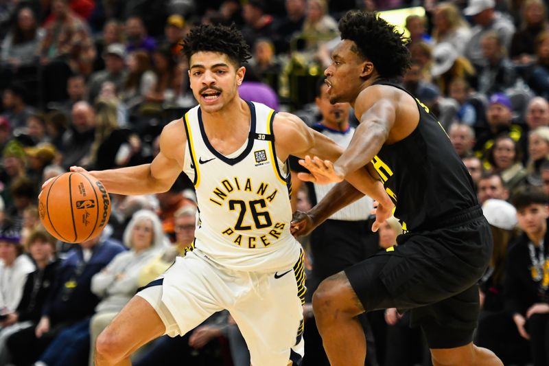 SALT LAKE CITY, UTAH - JANUARY 15: Ben Sheppard #26 of the Indiana Pacers drives against Collin Sexton #2 of the Utah Jazz during the second half of a game at Delta Center on January 15, 2024 in Salt Lake City, Utah. NOTE TO USER: User expressly acknowledges and agrees that, by downloading and or using this photograph, User is consenting to the terms and conditions of the Getty Images License Agreement. (Photo by Alex Goodlett/Getty Images)