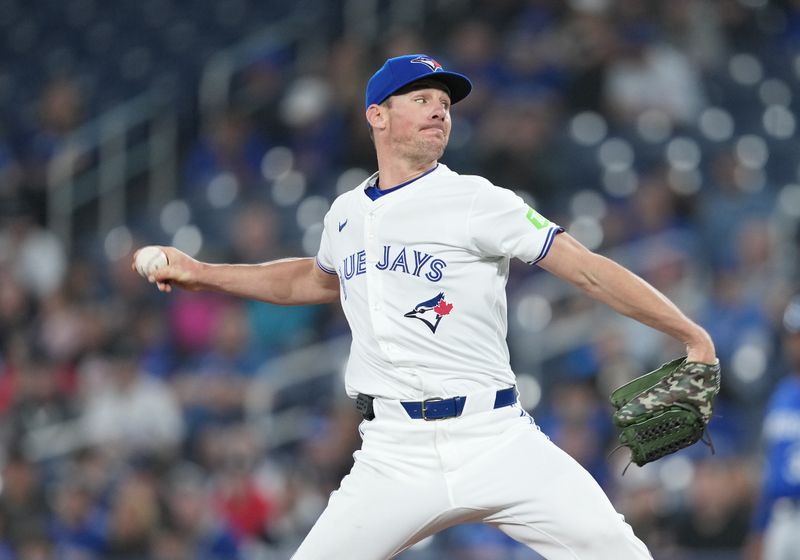 May 1, 2024; Toronto, Ontario, CAN; Toronto Blue Jays starting pitcher Chris Bassitt (40) throws a pitch against the Kansas City Royals during the first inning at Rogers Centre. Mandatory Credit: Nick Turchiaro-USA TODAY Sports