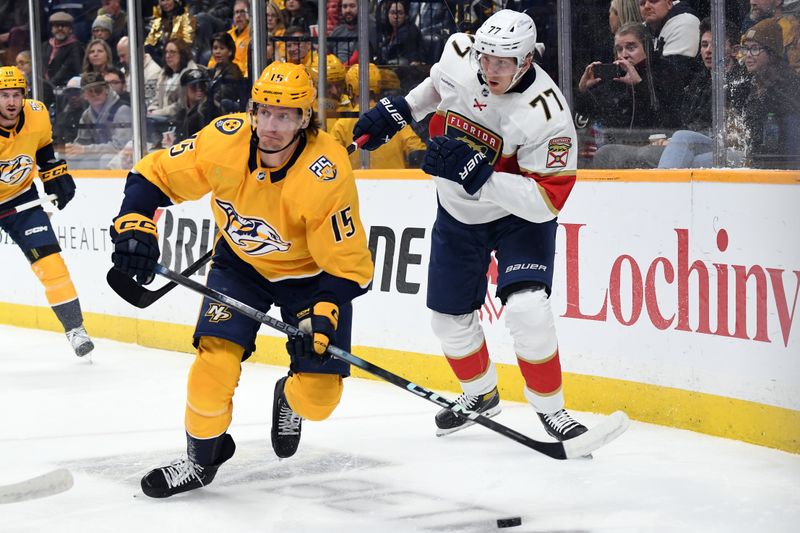 Jan 22, 2024; Nashville, Tennessee, USA; Nashville Predators right wing Denis Gurianov (15) handles the puck against Florida Panthers defenseman Niko Mikkola (77) during the first period at Bridgestone Arena. Mandatory Credit: Christopher Hanewinckel-USA TODAY Sports