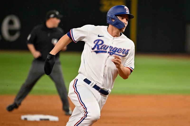 Oct 10, 2023; Arlington, Texas, USA; Texas Rangers shortstop Corey Seager (5) runs to third in the second inning against the Baltimore Orioles during game three of the ALDS for the 2023 MLB playoffs at Globe Life Field. Mandatory Credit: Jerome Miron-USA TODAY Sports