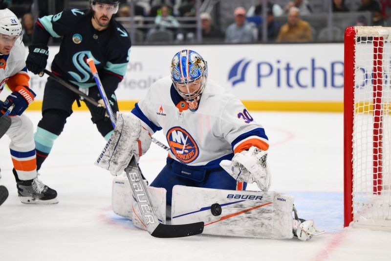 Nov 16, 2024; Seattle, Washington, USA; New York Islanders goaltender Ilya Sorokin (30) blocks a goal shot against the Seattle Kraken during the first period at Climate Pledge Arena. Mandatory Credit: Steven Bisig-Imagn Images