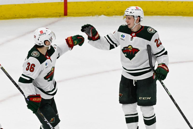 Apr 7, 2024; Chicago, Illinois, USA;  Minnesota Wild center Marco Rossi (23) celebrates with right wing Mats Zuccarello (36) after he scores against the Chicago Blackhawks during the second period at United Center. Mandatory Credit: Matt Marton-USA TODAY Sports