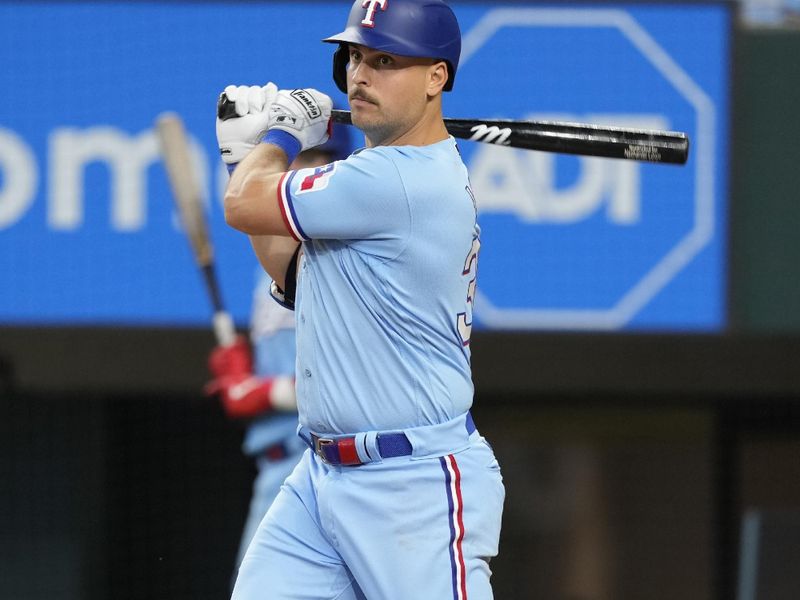 Aug 20, 2023; Arlington, Texas, USA; Texas Rangers first baseman Nathaniel Lowe (30) follows through on his double against the Milwaukee Brewers during the third inning at Globe Life Field. Mandatory Credit: Jim Cowsert-USA TODAY Sports