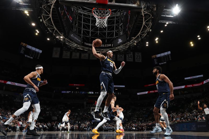 MINNEAPOLIS, MN - OCTOBER 17: Aaron Gordon #32 of the Denver Nuggets goes up for the rebound during the game against the Minnesota Timberwolves during a NBA Preseason game on October 17, 2024 at Target Center in Minneapolis, Minnesota. NOTE TO USER: User expressly acknowledges and agrees that, by downloading and or using this Photograph, user is consenting to the terms and conditions of the Getty Images License Agreement. Mandatory Copyright Notice: Copyright 2024 NBAE (Photo by Jordan Johnson/NBAE via Getty Images)