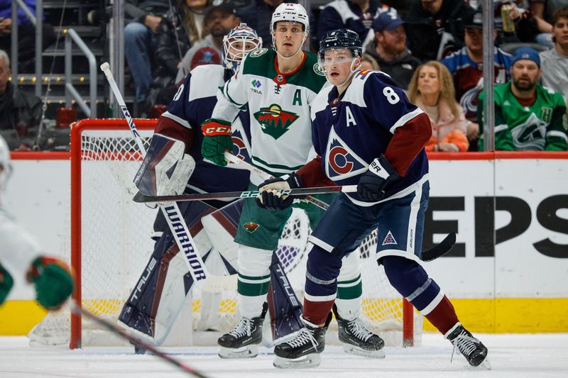 Mar 8, 2024; Denver, Colorado, USA; Minnesota Wild center Joel Eriksson Ek (14) and Colorado Avalanche defenseman Cale Makar (8) look on a head of goaltender Alexandar Georgiev (40) in the second period at Ball Arena. Mandatory Credit: Isaiah J. Downing-USA TODAY Sports