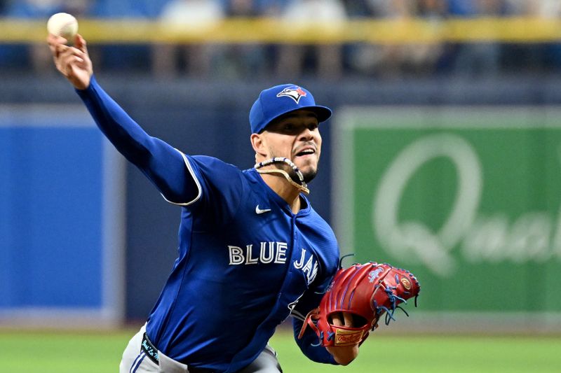 Sep 20, 2024; St. Petersburg, Florida, USA; Toronto Blue Jays starting pitcher Jose Berrios (17) throws a pitch in the first inning against the Tampa Bay Rays at Tropicana Field. Mandatory Credit: Jonathan Dyer-Imagn Images