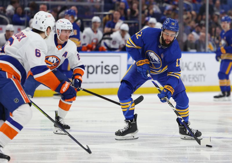 Mar 14, 2024; Buffalo, New York, USA;  Buffalo Sabres left wing Jordan Greenway (12) takes a shot on goal during the second period against the New York Islanders at KeyBank Center. Mandatory Credit: Timothy T. Ludwig-USA TODAY Sports