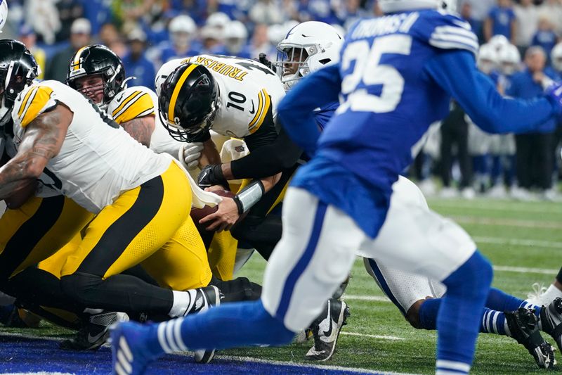 Pittsburgh Steelers quarterback Mitch Trubisky (10) scores during the first half of an NFL football game against the Indianapolis Colts in Indianapolis Saturday, Dec. 16, 2023. (AP Photo/Michael Conroy)