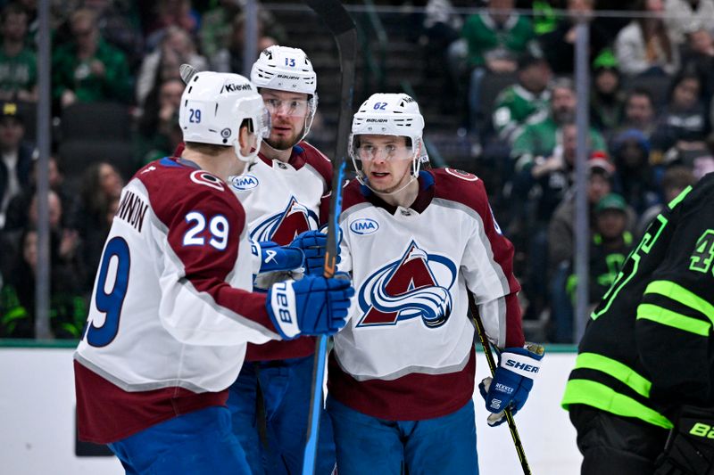 Nov 29, 2024; Dallas, Texas, USA; Colorado Avalanche center Nathan MacKinnon (29) and right wing Valeri Nichushkin (13) and left wing Artturi Lehkonen (62) celebrates a goal scored by Lehkonen against the Dallas Stars during the third period at the American Airlines Center. Mandatory Credit: Jerome Miron-Imagn Images