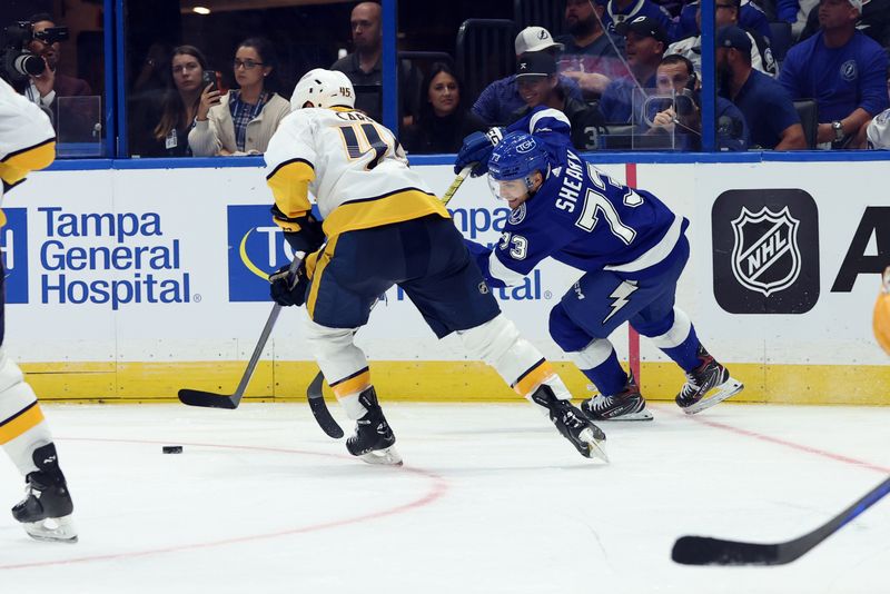 Oct 10, 2023; Tampa, Florida, USA; Tampa Bay Lightning left wing Conor Sheary (73) skates with the puck as Nashville Predators defenseman Alexandre Carrier (45) defends during the third period at Amalie Arena. Mandatory Credit: Kim Klement Neitzel-USA TODAY Sports