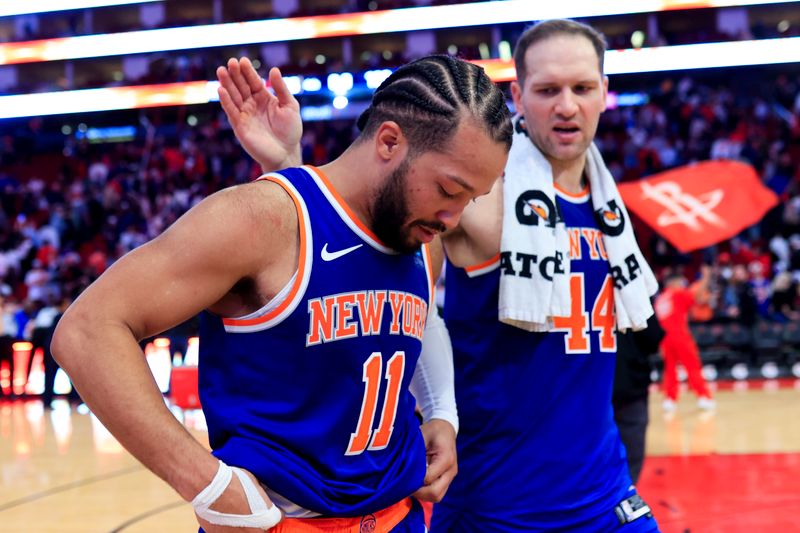 HOUSTON, TEXAS - FEBRUARY 12: Jalen Brunson #11 of the New York Knicks and Charlie Brown Jr. #44  walk off the court after losing to the Houston Rockets 105-103 at Toyota Center on February 12, 2024 in Houston, Texas. NOTE TO USER: User expressly acknowledges and agrees that, by downloading and or using this photograph, User is consenting to the terms and conditions of the Getty Images License Agreement. (Photo by Carmen Mandato/Getty Images)