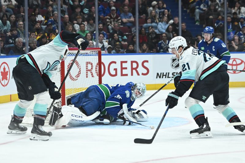 Apr 2, 2025; Vancouver, British Columbia, CAN;  Vancouver Canucks goaltender Thatcher Demko (35) defends against Seattle Kraken forward Michael Eyssimont (21) during the third period at Rogers Arena. Mandatory Credit: Simon Fearn-Imagn Images