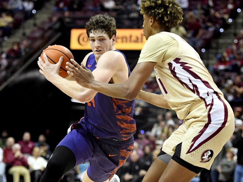 Jan 28, 2023; Tallahassee, Florida, USA; Clemson Tigers forward PJ Hall (24) drives to the net against Florida State Seminoles forward Baba Miller (11) during the second half at Donald L. Tucker Center. Mandatory Credit: Melina Myers-USA TODAY Sports