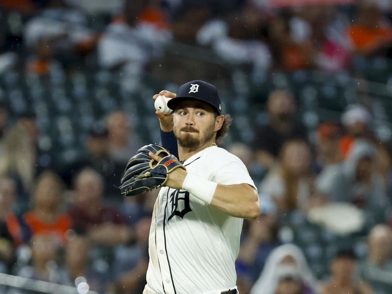 Jul 9, 2024; Detroit, Michigan, USA;  Detroit Tigers third baseman Zach McKinstry (39) makes a throw to first in the eighth inning against the Cleveland Guardians at Comerica Park. Mandatory Credit: Rick Osentoski-USA TODAY Sports