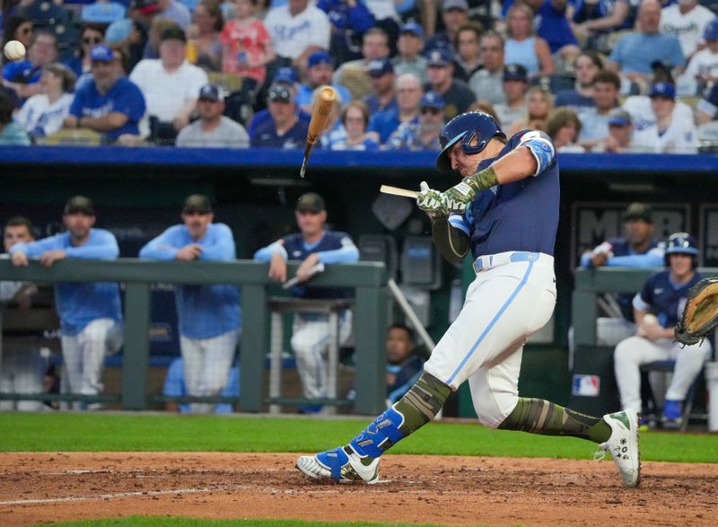 May 17, 2024; Kansas City, Missouri, USA; Kansas City Royals right fielder Hunter Renfroe (16) breaks his bat hitting a single against the Oakland Athletics in the sixth inning at Kauffman Stadium. Mandatory Credit: Denny Medley-USA TODAY Sports