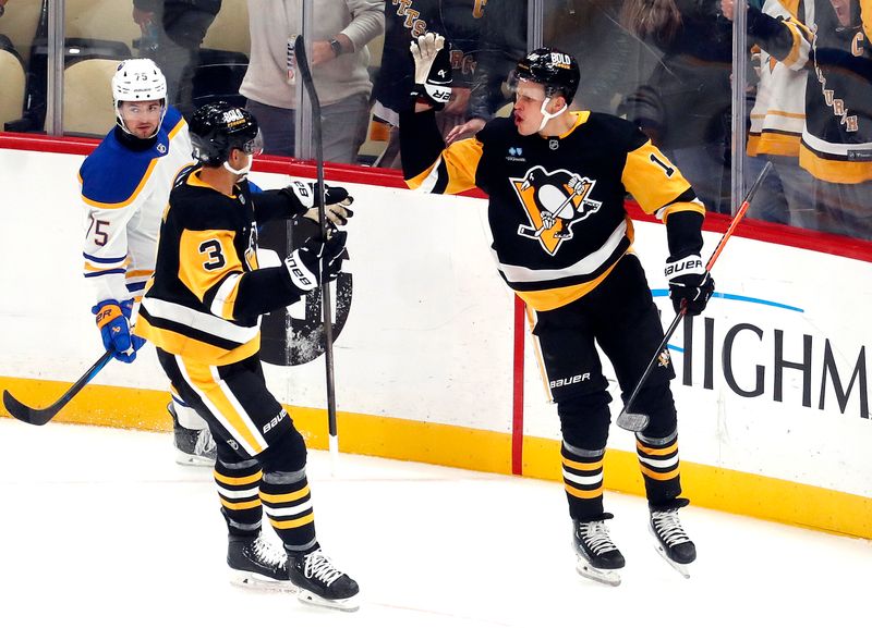 Oct 16, 2024; Pittsburgh, Pennsylvania, USA;  Pittsburgh Penguins defenseman Jack St. Ivany (3) congratulates right wing Jesse Puljujarvi (18) on his goal against the Buffalo Sabres during the second period at PPG Paints Arena. Mandatory Credit: Charles LeClaire-Imagn Images