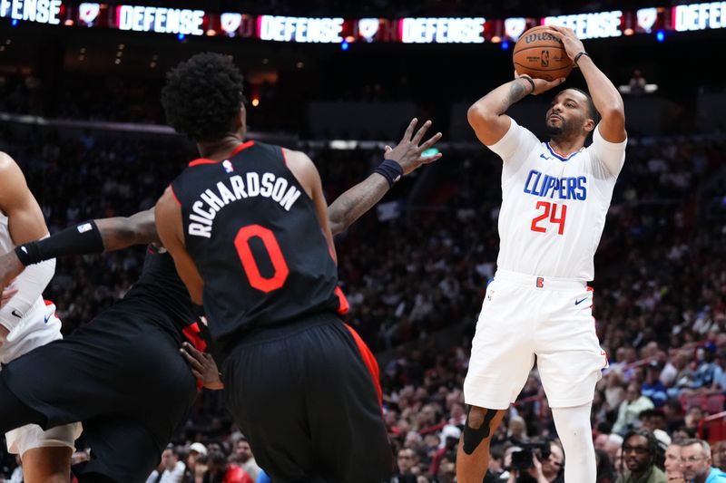 MIAMI, FLORIDA - FEBRUARY 04: Norman Powell #24 of the LA Clippers goes up for a shot against the Miami Heat during the third quarter at Kaseya Center on February 04, 2024 in Miami, Florida. User expressly acknowledges and agrees that, by downloading and or using this photograph, User is consenting to the terms and conditions of the Getty Images License Agreement. (Photo by Rich Storry/Getty Images)