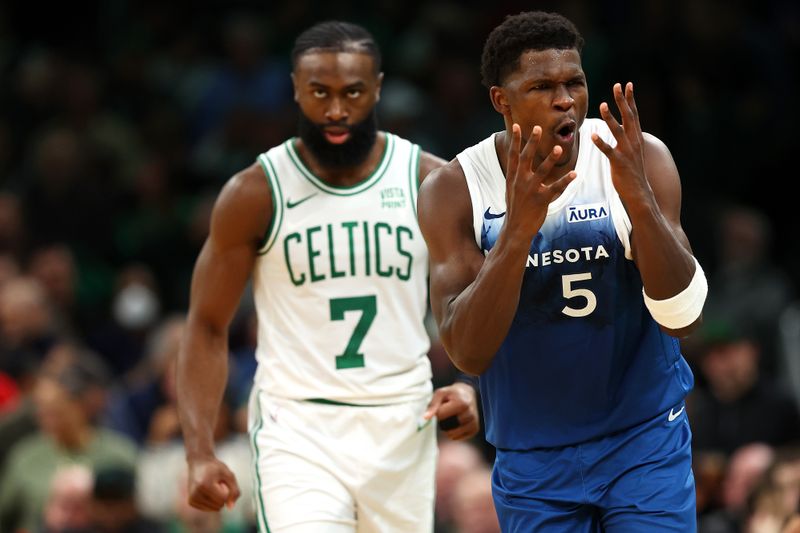 BOSTON, MASSACHUSETTS - JANUARY 10: Anthony Edwards #5 of the Minnesota Timberwolves celebrates next to Jaylen Brown #7 of the Boston Celtics after scoring during the fourth quarter at TD Garden on January 10, 2024 in Boston, Massachusetts. The Celtics defeat the Timberwolves 127-120 in overtime. NOTE TO USER: User expressly acknowledges and agrees that, by downloading and or using this photograph, user is consenting to the terms and conditions of the Getty Images License Agreement.  (Photo by Maddie Meyer/Getty Images)