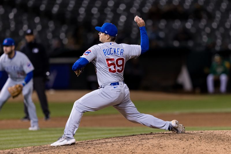 Apr 18, 2023; Oakland, California, USA;  Chicago Cubs closing pitcher Michael Rucker (59) throws against the Oakland Athletics during the ninth inning at RingCentral Coliseum. Mandatory Credit: John Hefti-USA TODAY Sports