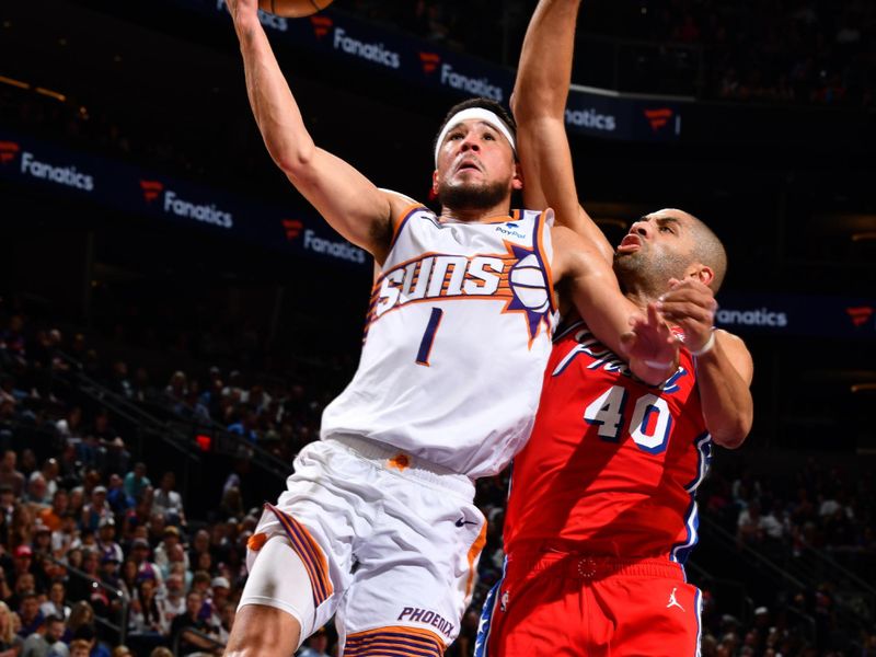 PHOENIX, AZ - MARCH 20: Devin Booker #1 of the Phoenix Suns drives to the basket during the game against the Philadelphia 76ers on March 20, 2024 at Footprint Center in Phoenix, Arizona. NOTE TO USER: User expressly acknowledges and agrees that, by downloading and or using this photograph, user is consenting to the terms and conditions of the Getty Images License Agreement. Mandatory Copyright Notice: Copyright 2024 NBAE (Photo by Barry Gossage/NBAE via Getty Images)