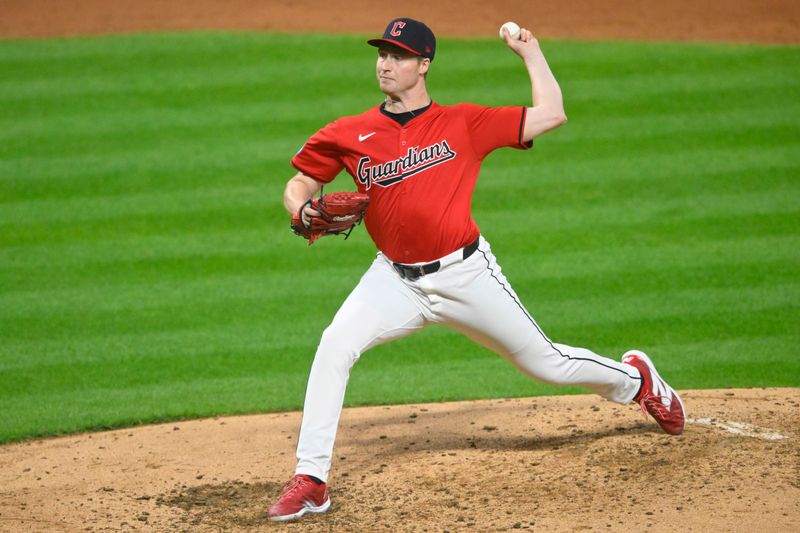 May 3, 2024; Cleveland, Ohio, USA; Cleveland Guardians relief pitcher Tim Herrin (29) delivers a pitch in the the sixth inning against the Los Angeles Angels at Progressive Field. Mandatory Credit: David Richard-USA TODAY Sports