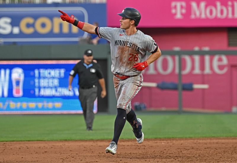 Jul 29, 2023; Kansas City, Missouri, USA;  Minnesota Twins right fielder Max Kepler (26) reacts after hitting a solo home run during the sixth inning against the Kansas City Royals at Kauffman Stadium. Mandatory Credit: Peter Aiken-USA TODAY Sports