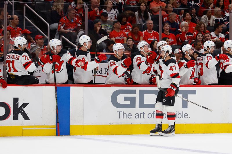 Oct 12, 2024; Washington, District of Columbia, USA; New Jersey Devils center Paul Cotter (47) celebrates with teammates after scoring a goal against the Washington Capitals in the first period at Capital One Arena. Mandatory Credit: Geoff Burke-Imagn Images