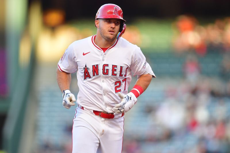 Apr 23, 2024; Anaheim, California, USA; Los Angeles Angels center fielder Mike Trout (27) rounds the bases after hitting a solo home run against the Baltimore Orioles during the first inning at Angel Stadium. Mandatory Credit: Gary A. Vasquez-USA TODAY Sports