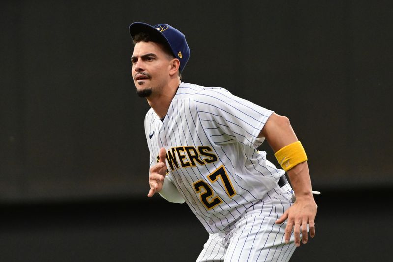 Jun 11, 2023; Milwaukee, Wisconsin, USA; Milwaukee Brewers shortstop Willy Adames (27) warms up before game against the Oakland Athletes at American Family Field. Mandatory Credit: Benny Sieu-USA TODAY Sports