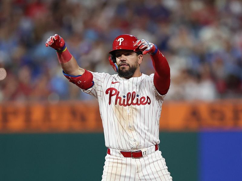 Aug 3, 2025; Philadelphia, Pennsylvania, USA; Philadelphia Phillies outfielder Kyle Schwarber (12) reacts after hitting a double against the Detroit Tigers during the sixth inning at Citizens Bank Park. Mandatory Credit: Bill Streicher-Imagn Images