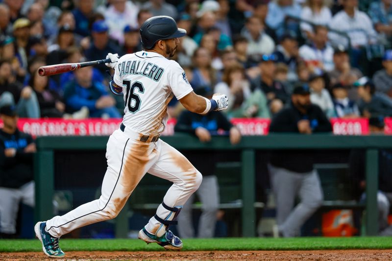 Jun 13, 2023; Seattle, Washington, USA; Seattle Mariners second baseman Jose Caballero (76) hits a three-run triple against the Miami Marlins during the sixth inning at T-Mobile Park. Mandatory Credit: Joe Nicholson-USA TODAY Sports