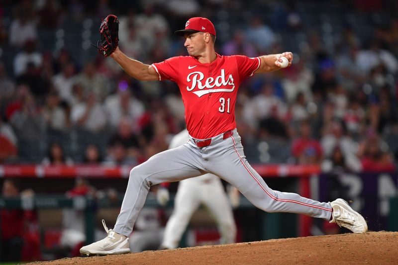 Aug 20, 2025; Anaheim, California, USA; Cincinnati Reds pitcher Brent Suter (31) throws against the Los Angeles Angels during the eighth inning at Angel Stadium. Mandatory Credit: Gary A. Vasquez-Imagn Images