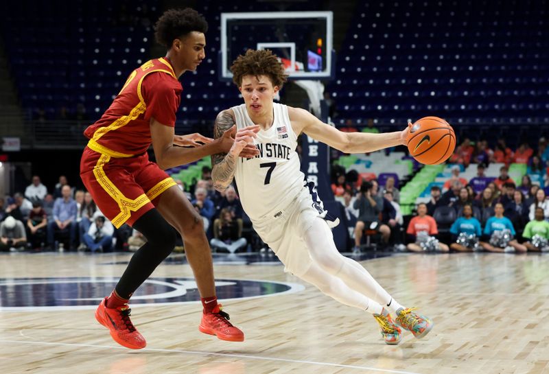 Feb 8, 2026; University Park, Pennsylvania, USA; Penn State Nittany Lions guard Dominick Stewart (7) dribbles the ball around the outside of Southern California Trojans guard Alijah Arenas (0) during the first half at Bryce Jordan Center. Mandatory Credit: Matthew O'Haren-Imagn Images