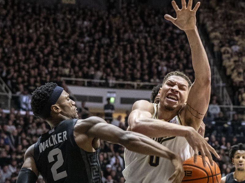 Mar 2, 2024; West Lafayette, Indiana, USA; Michigan State Spartans guard Tyson Walker (2) knocks the ball way from Purdue Boilermakers forward Mason Gillis (0) during the second half at Mackey Arena. Mandatory Credit: Marc Lebryk-USA TODAY Sports