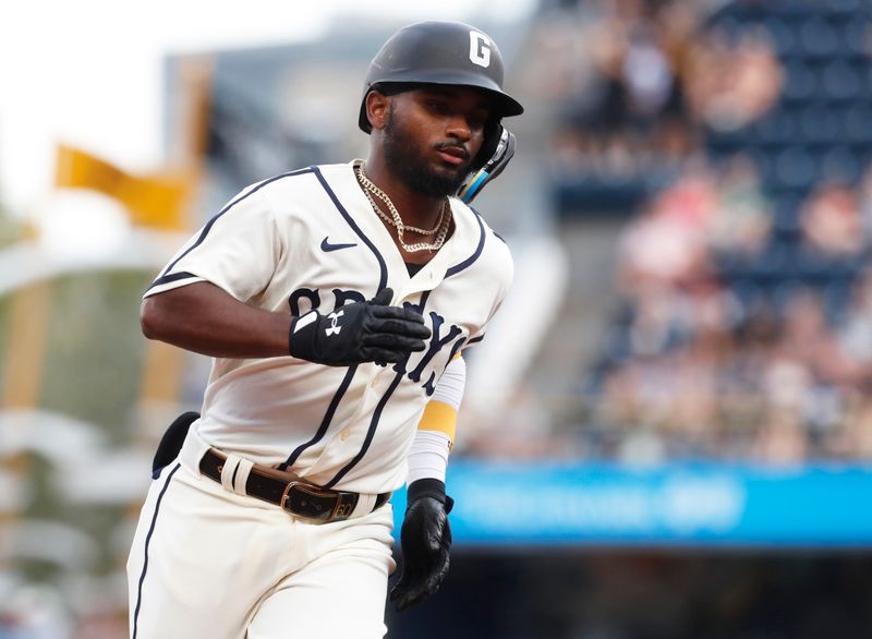 Aug 13, 2023; Pittsburgh, PA, USA; Pittsburgh Pirates second baseman Liover Peguero (60) circles the bases on a solo home run against the Cincinnati Reds during the second inning at PNC Park. Mandatory Credit: Charles LeClaire-USA TODAY Sports