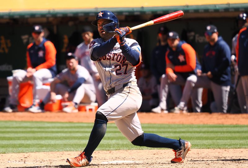 May 25, 2024; Oakland, California, USA; Houston Astros second baseman Jose Altuve (27) on a strike Oakland Athletics during the eighth inning at Oakland-Alameda County Coliseum. Mandatory Credit: Kelley L Cox-USA TODAY Sports