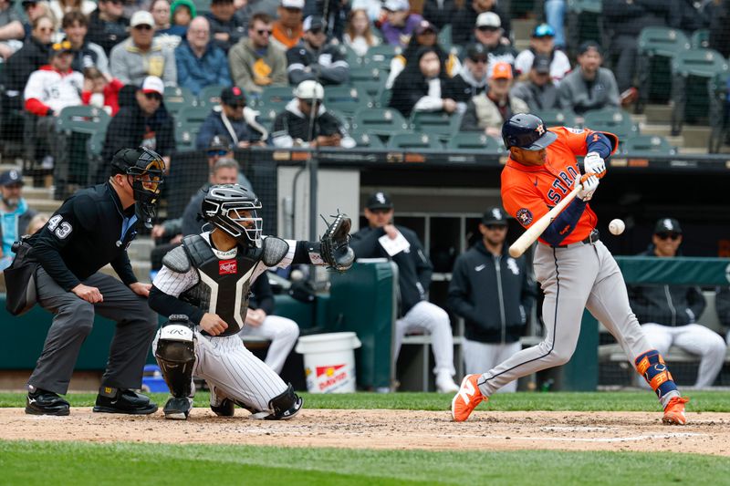 May 4, 2025; Chicago, Illinois, USA; Houston Astros shortstop Jeremy Pena (3) singles against the Chicago White Sox during the fourth inning at Rate Field. Mandatory Credit: Kamil Krzaczynski-Imagn Images