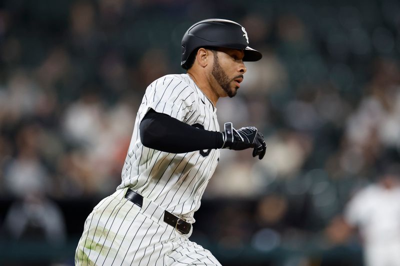 Apr 30, 2024; Chicago, Illinois, USA; Chicago White Sox outfielder Tommy Pham (28) runs to first base after hitting a single against the Minnesota Twins during the ninth inning at Guaranteed Rate Field. Mandatory Credit: Kamil Krzaczynski-USA TODAY Sports