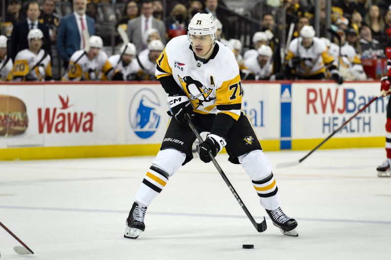 Apr 2, 2024; Newark, New Jersey, USA; Pittsburgh Penguins center Evgeni Malkin (71) skates with the puck during the third period against the New Jersey Devils at Prudential Center. Mandatory Credit: John Jones-USA TODAY Sports