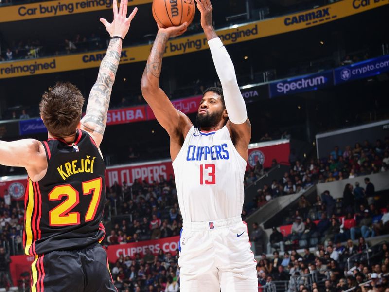 LOS ANGELES, CA - MARCH 17: Paul George #13 of the LA Clippers shoots a three point basket against the Atlanta Hawks on March 17, 2024 at Crypto.Com Arena in Los Angeles, California. NOTE TO USER: User expressly acknowledges and agrees that, by downloading and/or using this Photograph, user is consenting to the terms and conditions of the Getty Images License Agreement. Mandatory Copyright Notice: Copyright 2024 NBAE (Photo by Adam Pantozzi/NBAE via Getty Images)