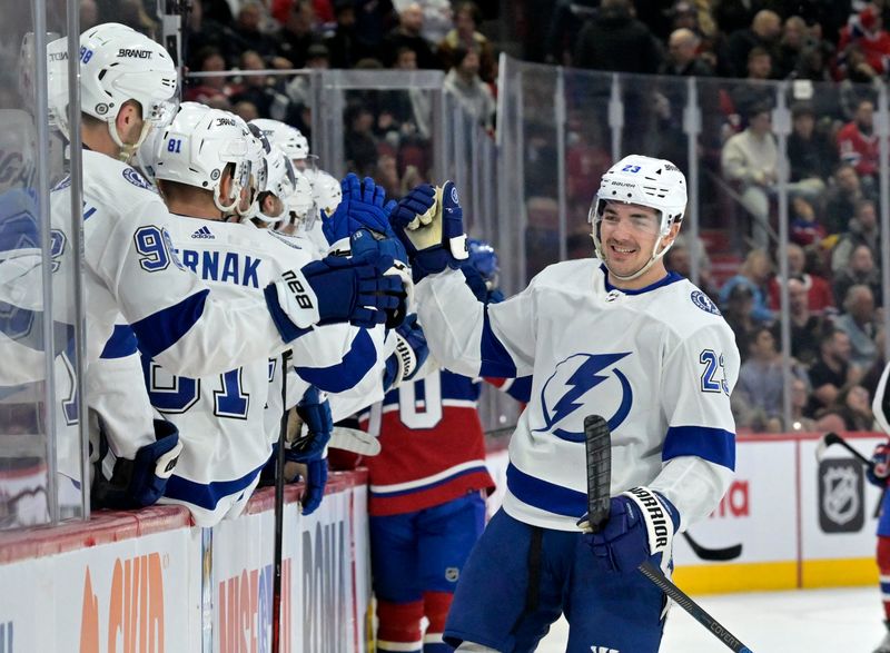 Nov 7, 2023; Montreal, Quebec, CAN; Tampa Bay Lightning forward Michael Eyssimont (23) celebrates with teammates after scoring a goal against the Montreal Canadiens during the first period at the Bell Centre. Mandatory Credit: Eric Bolte-USA TODAY Sports