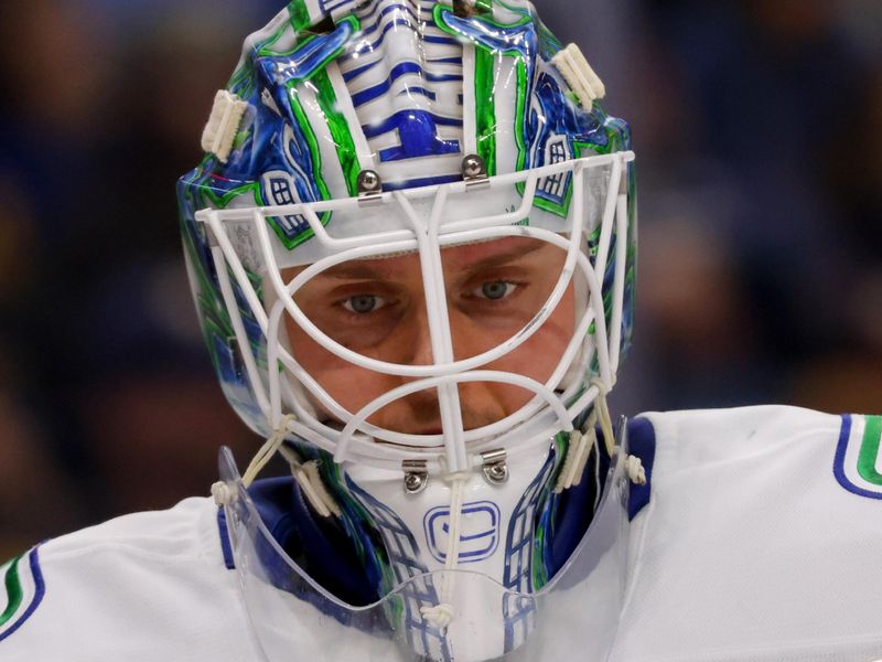 Nov 29, 2024; Buffalo, New York, USA;  Vancouver Canucks goaltender Kevin Lankinen (32) during a stoppage in play against the Buffalo Sabres during the second period at KeyBank Center. Mandatory Credit: Timothy T. Ludwig-Imagn Images