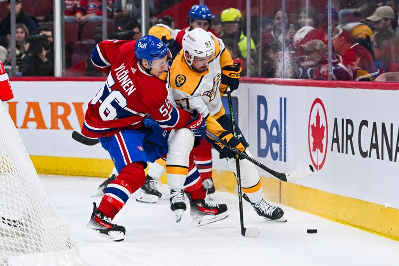Dec 10, 2023; Montreal, Quebec, CAN; Nashville Predators defenseman Dante Fabbro (57) defends the puck against Montreal Canadiens right wing Jesse Ylonen (56) near the boards during the first period at Bell Centre. Mandatory Credit: David Kirouac-USA TODAY Sports