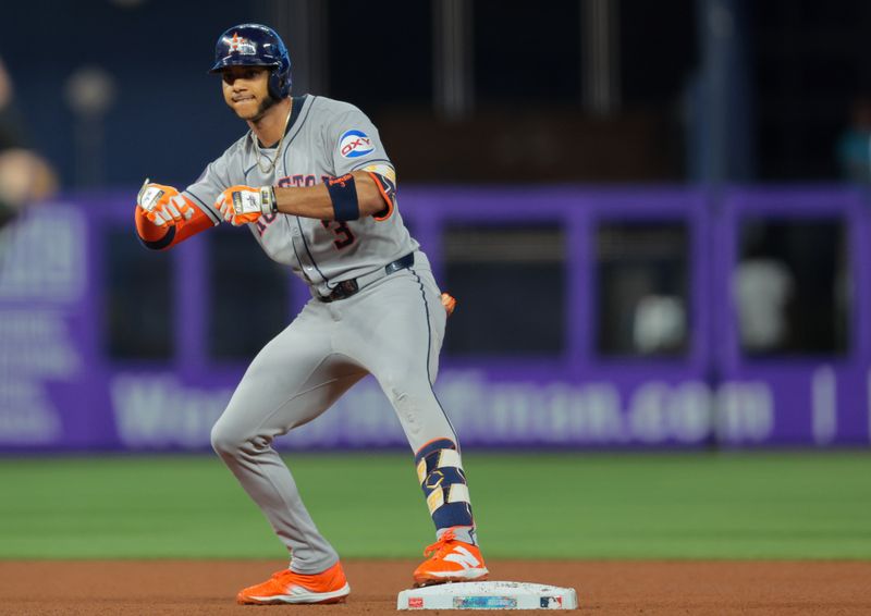 Aug 4, 2025; Miami, Florida, USA; Houston Astros shortstop Jeremy Pena (3) reacts from second base after hitting a double against the Miami Marlins during the fourth inning at loanDepot Park. Mandatory Credit: Sam Navarro-Imagn Images