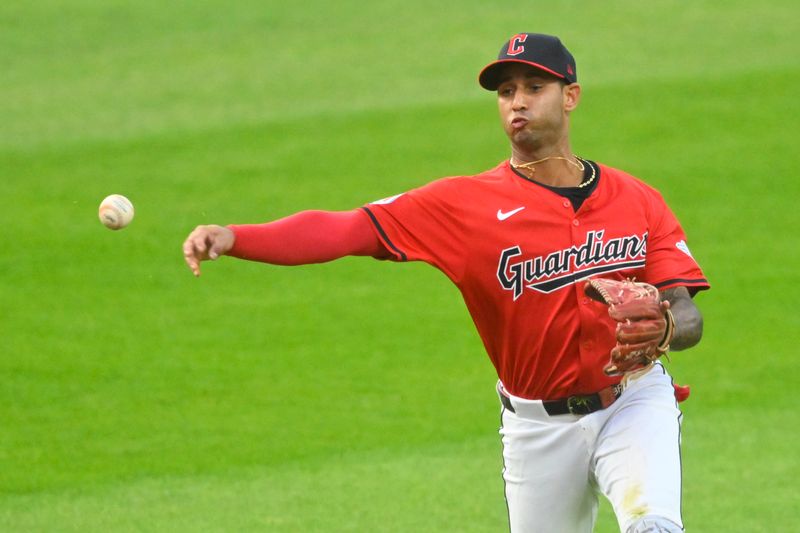 Sep 17, 2024; Cleveland, Ohio, USA; Cleveland Guardians shortstop Brayan Rocchio (4) throws to first base in the second inning against the Minnesota Twins at Progressive Field. Mandatory Credit: David Richard-Imagn Images