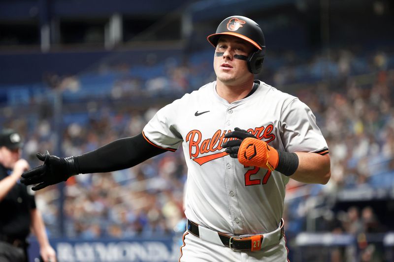 Jun 10, 2024; St. Petersburg, Florida, USA;  Baltimore Orioles catcher James McCann (27) celebrates after he hit a home run during the third inning against the Tampa Bay Rays at Tropicana Field. Mandatory Credit: Kim Klement Neitzel-USA TODAY Sports