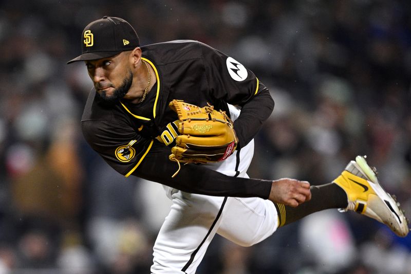 Mar 25, 2024; San Diego, California, USA; San Diego Padres relief pitcher Robert Suarez (75) throws a pitch against the Seattle Mariners during the ninth inning at Petco Park. Mandatory Credit: Orlando Ramirez-USA TODAY Sports