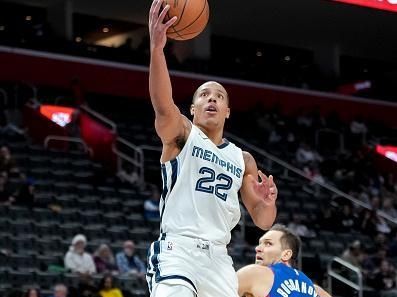 DETROIT, MICHIGAN - DECEMBER 06: Desmond Bane #22 of the Memphis Grizzlies shoots the ball against Bojan Bogdanovic #44 of the Detroit Pistons at Little Caesars Arena on December 06, 2023 in Detroit, Michigan. NOTE TO USER: User expressly acknowledges and agrees that, by downloading and or using this photograph, User is consenting to the terms and conditions of the Getty Images License Agreement. (Photo by Nic Antaya/Getty Images)