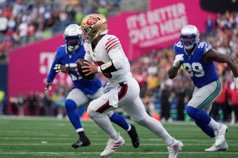 San Francisco 49ers quarterback Brock Purdy looks to throw during the first half of an NFL football game against the Seattle Seahawks, Thursday, Oct. 10, 2024, in Seattle. (AP Photo/Lindsey Wasson)